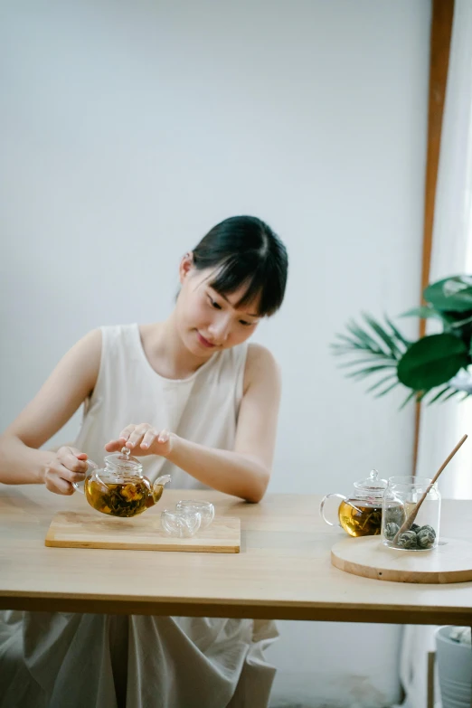 two women are at a table with some drinks