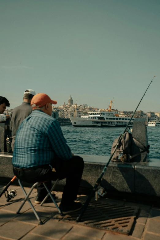 a person sitting on a chair while fishing