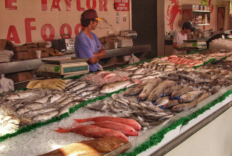 an open air market filled with lots of fish