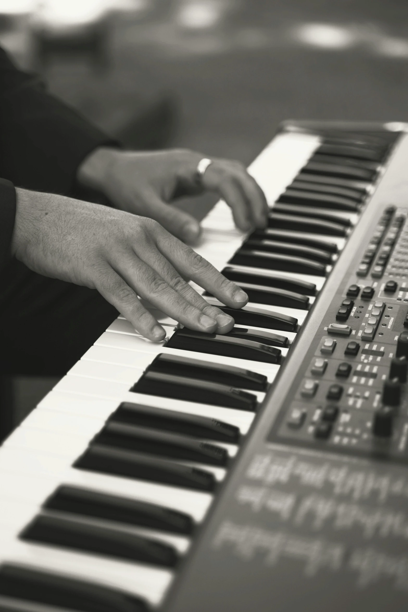 a person is playing the electronic keyboard