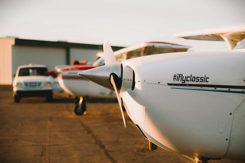 an airplane parked outside in front of another airplane