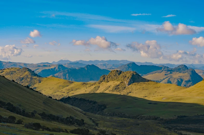 the hills surrounding the valley are dotted by thick vegetation