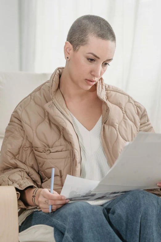 a person is sitting down doing soing in a notebook