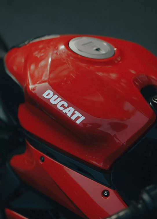 the front view of a ducati motorcycle parked in a lot