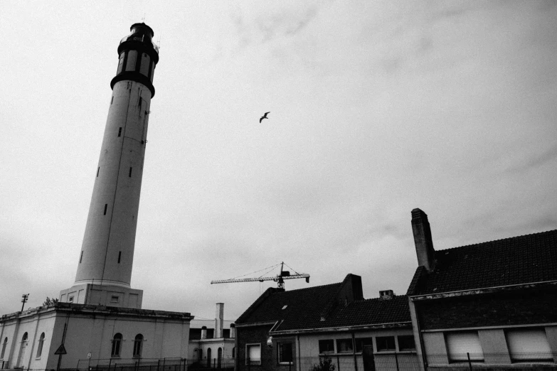 a lighthouse in the middle of some buildings