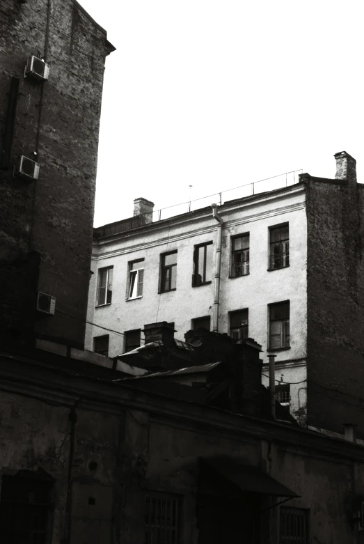 the top of a building with broken windows