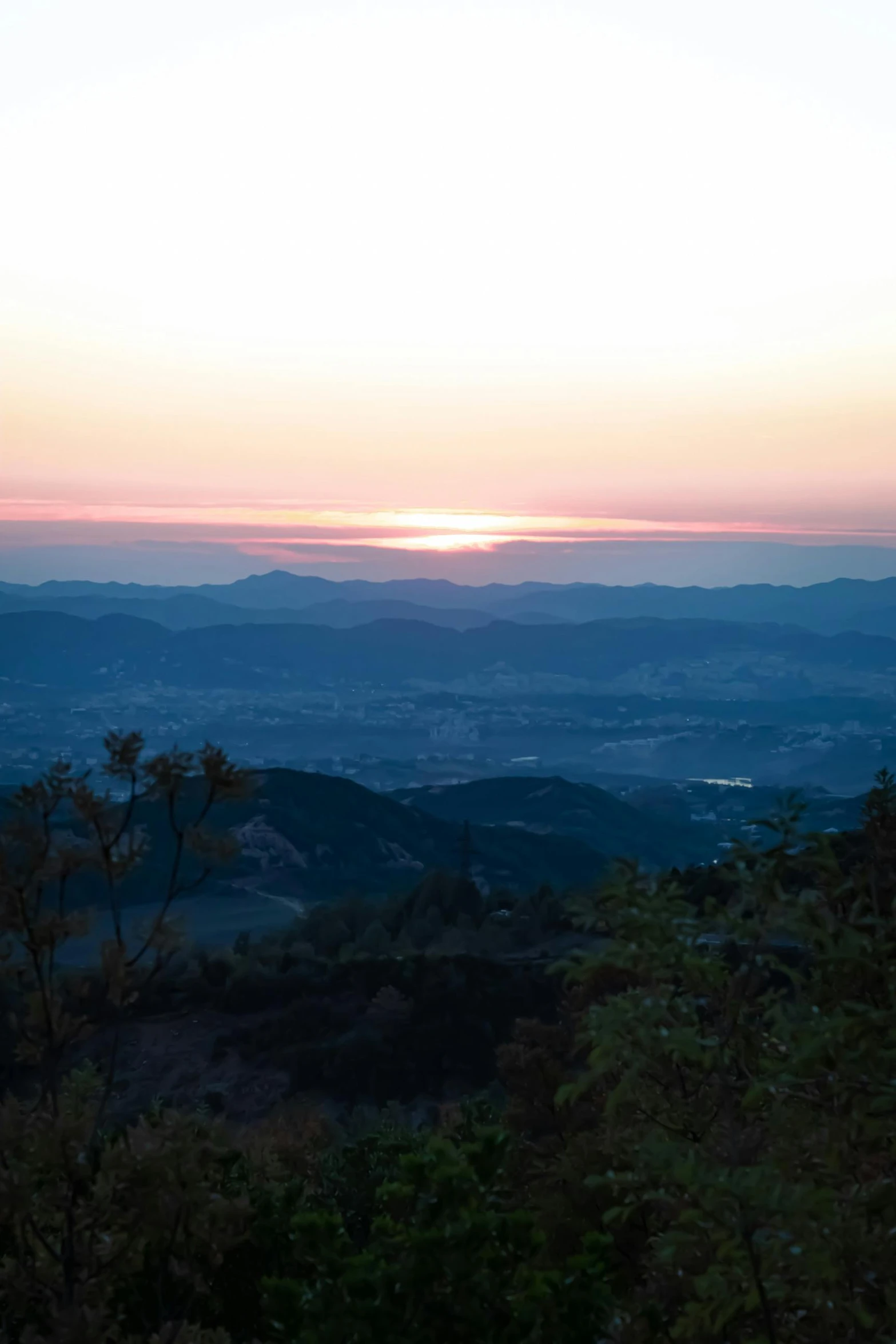 a sunset is shown with the sky and mountains