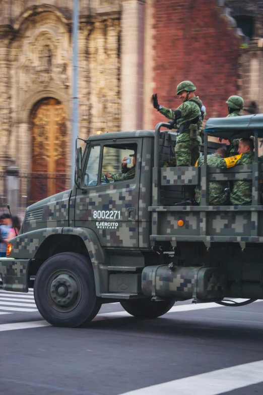 military vehicle with camouflage print on its body and driver