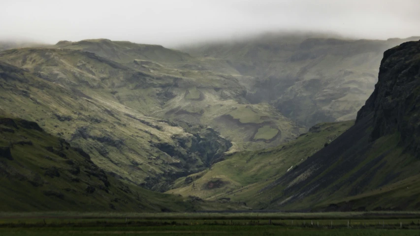 a mountainous landscape with large rocks on either side