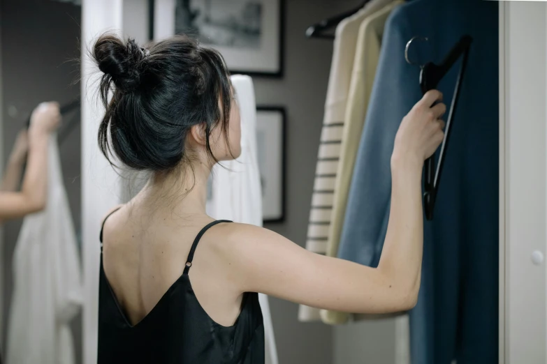 a woman in a black top and another woman with black hair