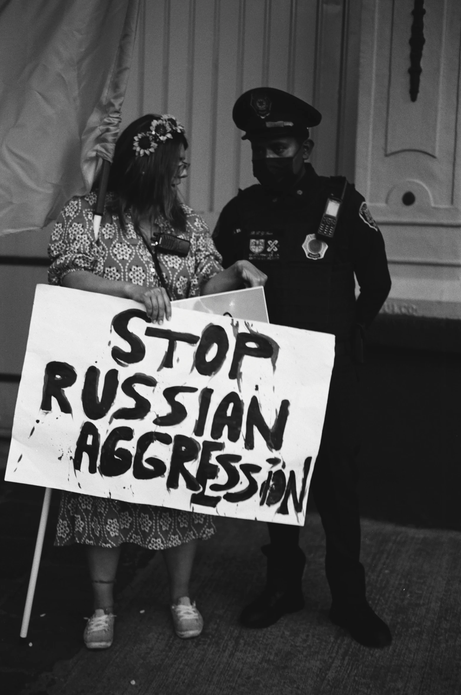 a man and woman holding a sign on stage