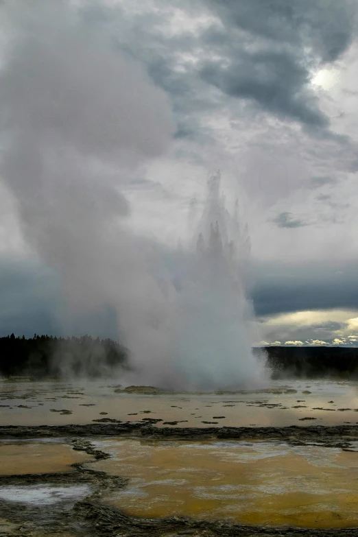 a geyser spewing water into the distance