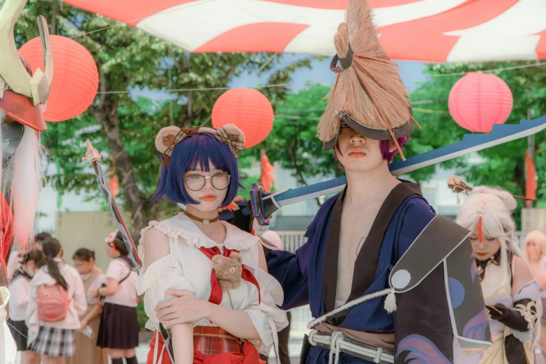 people dressed in costumes holding weapons at an event