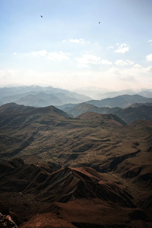 mountains in the background and a few clouds floating in the sky