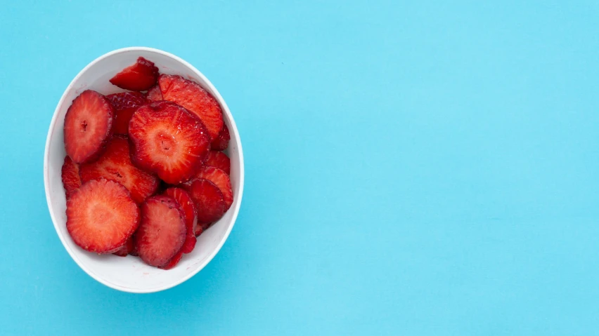 there are some strawberries on the blue plate