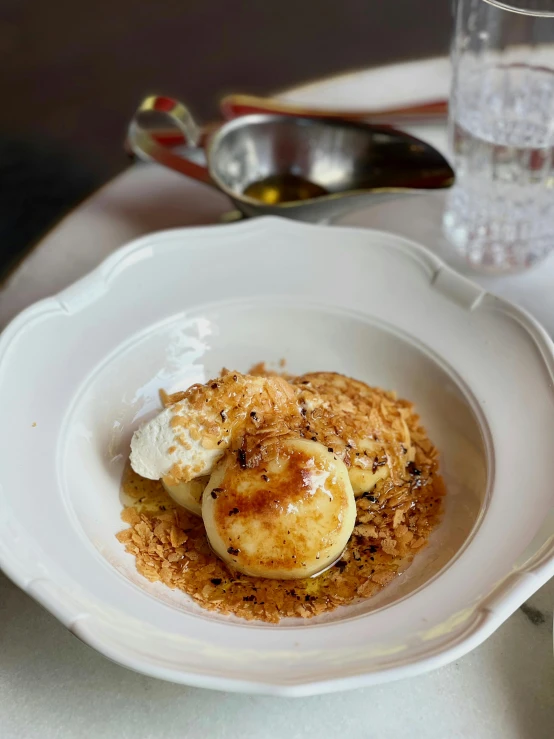 a white plate with a dessert on top of it