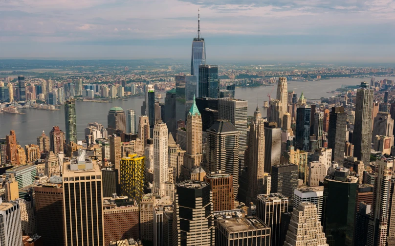 an aerial view of a city with large buildings