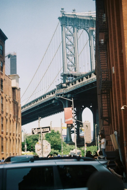 the traffic is flowing under the bridge from the sidewalk