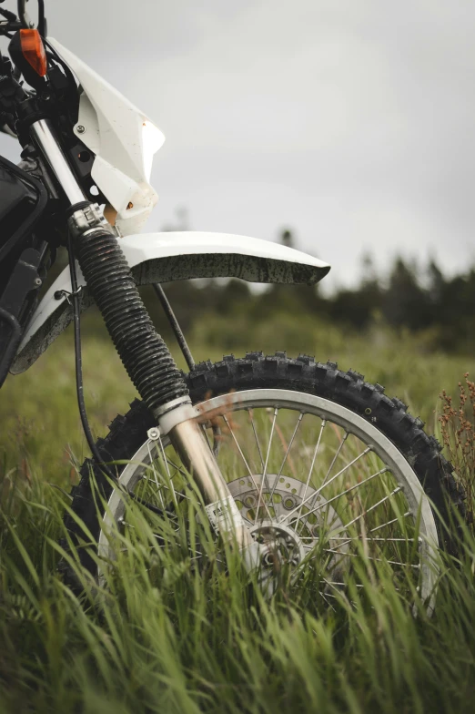 the bike is parked in a field