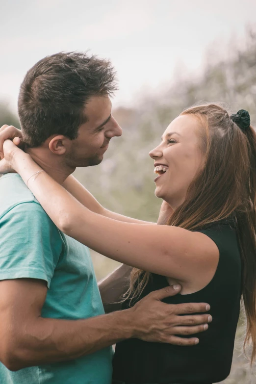 a couple in love emcing each other outdoors