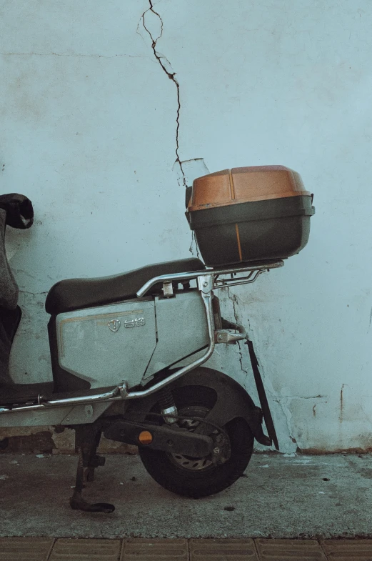 a motorcycle with a basket strapped to the front of it