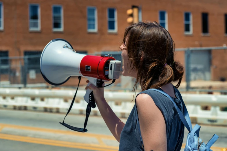 a woman with a red and white megaphone