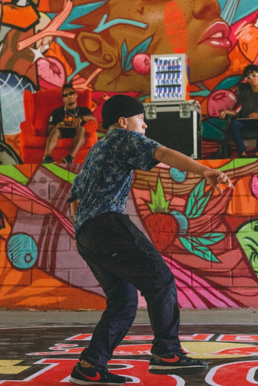 a man skating on the skateboard on a colorful street