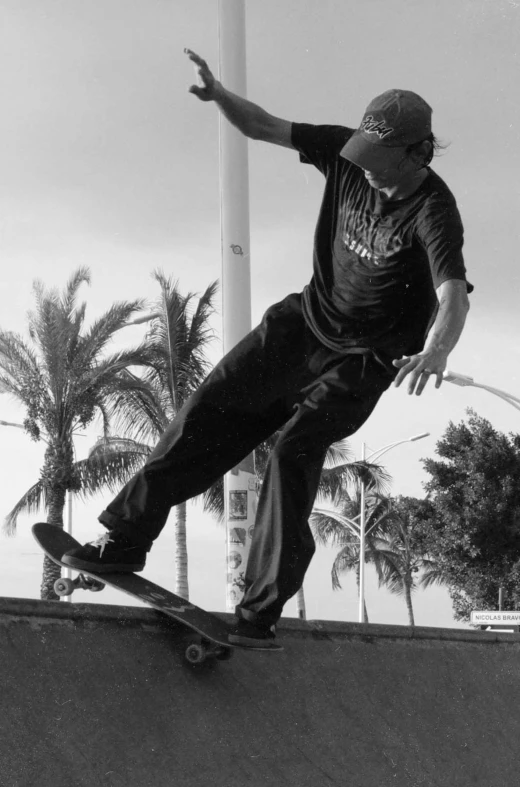 a man on a skateboard riding the edge of a ramp