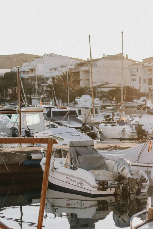 several boats parked near each other in the water