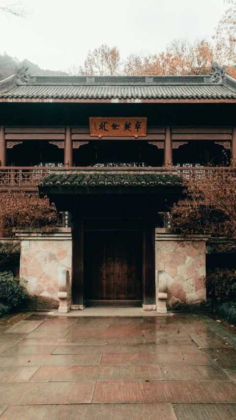 a building with tall pillars and red roof