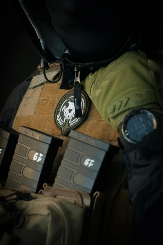 a military vest and badges is displayed on the chest