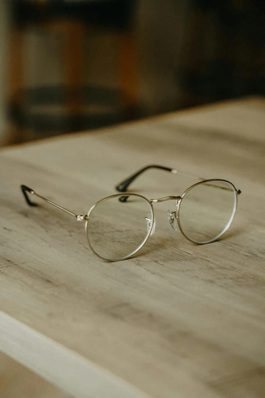 the silver glasses are resting on a table