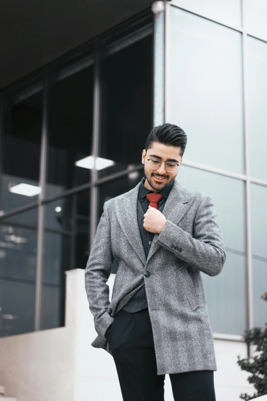 a young man dressed in a suit and bow tie