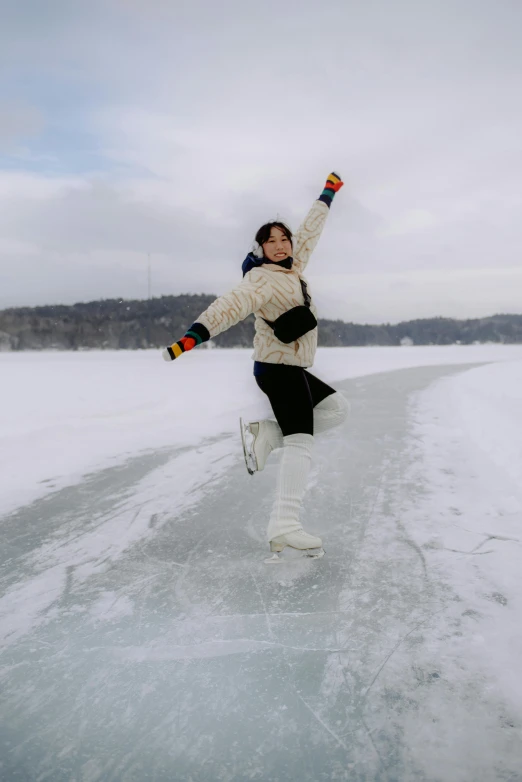 the woman is on the ice skating in the water