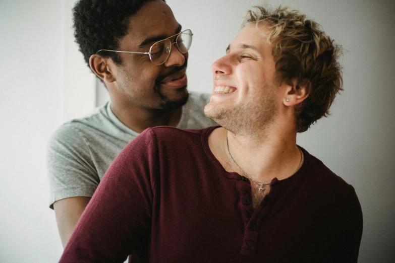 a man laughing next to another man