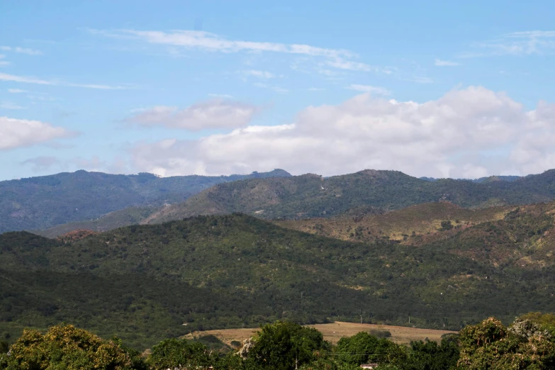 two large hills are seen with no trees