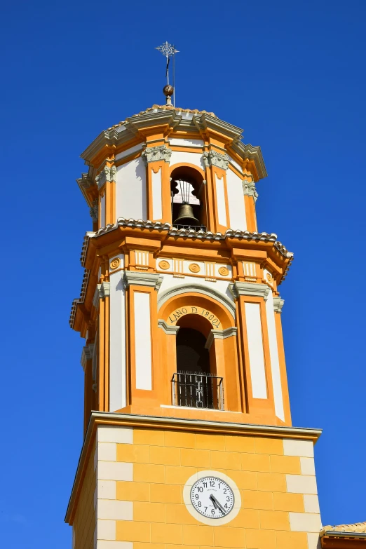 a building with a tower and a bell on top