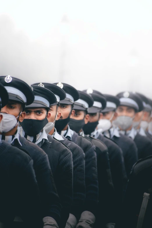 the officers are in uniform and wearing protective masks