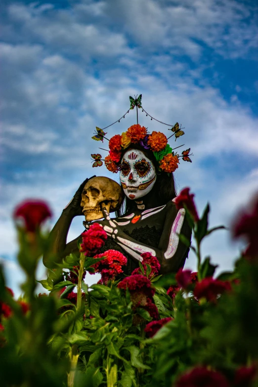 a woman with a skeleton face holding up her hands