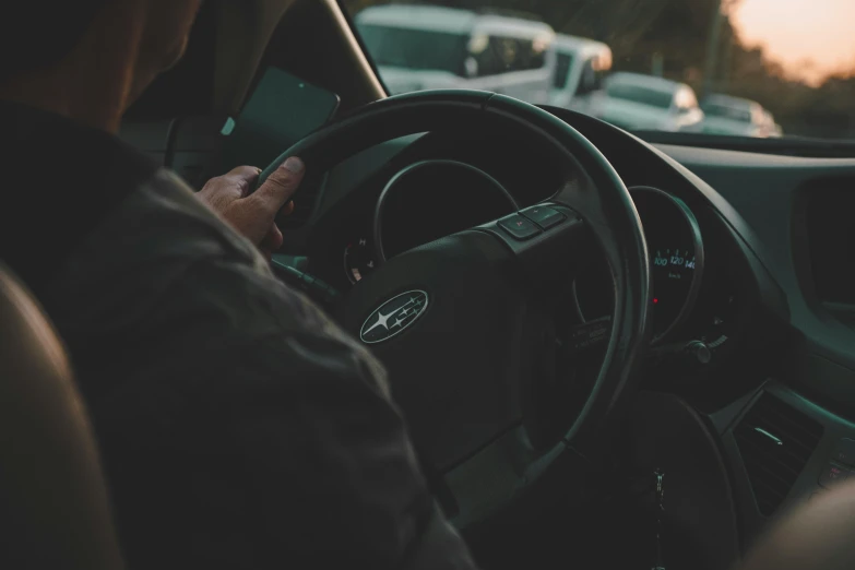 a person driving a car on a road