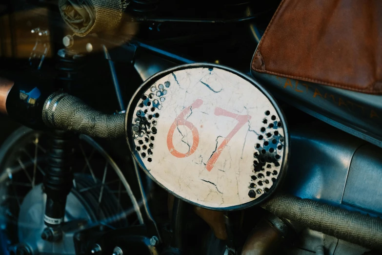 a motorcycle with a large white sign on it's back tire