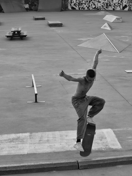 a person jumping into the air while riding a skateboard