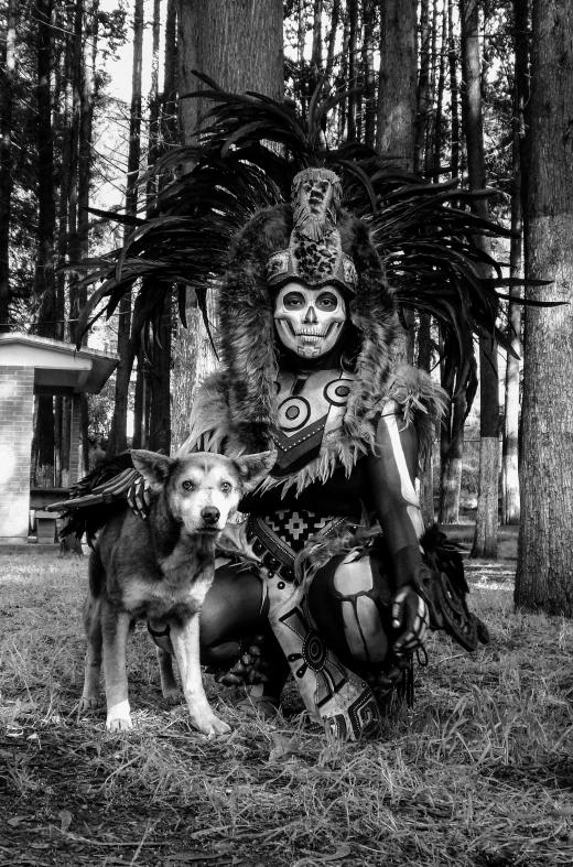 a black and white po of a woman sitting with a dog