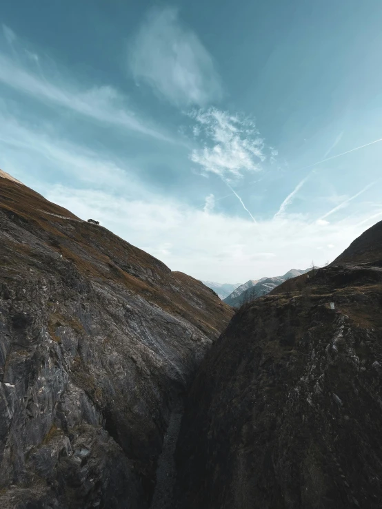 the rocky mountain landscape shows steep peaks and a blue sky