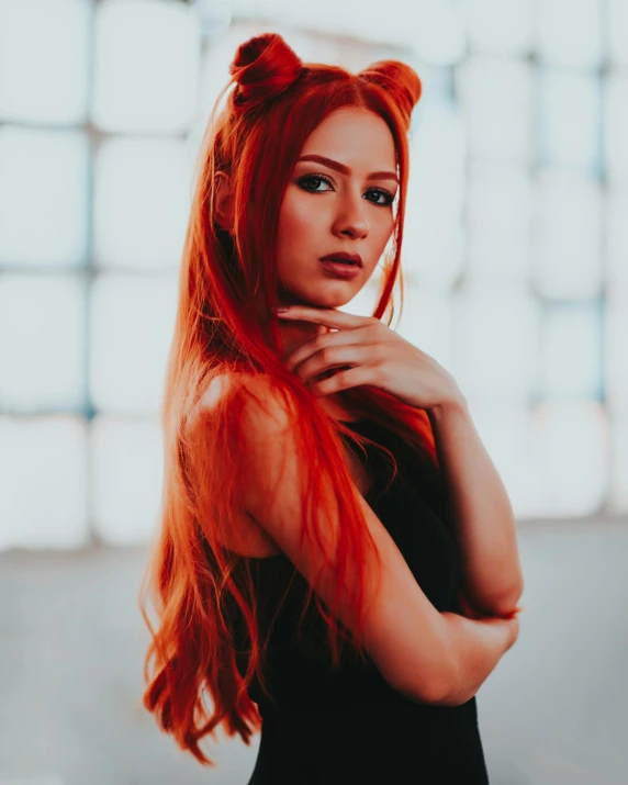 red - haired girl with big blue eyes in dark dress