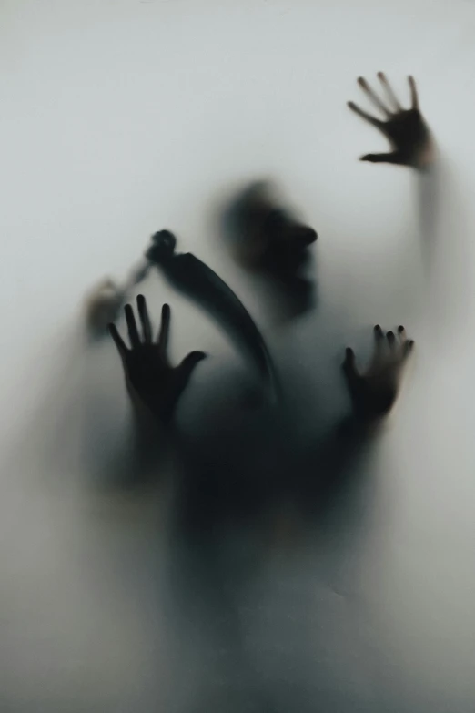the shadow of a person's hands in the fog