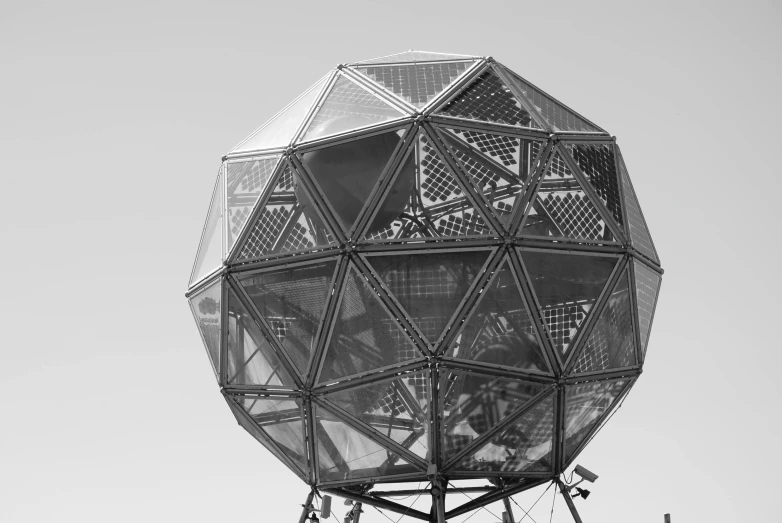 an observation device on top of a hill against a gray sky