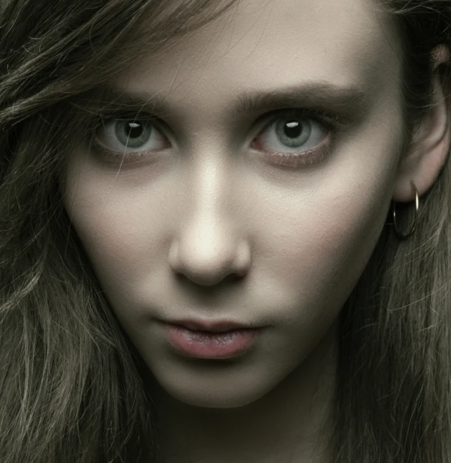 a woman is posing for the camera and it looks like she has on makeup