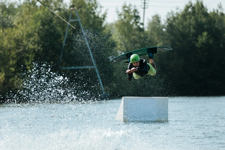 a person falling off a board on the water