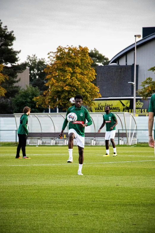 players are practicing soccer and training in the field